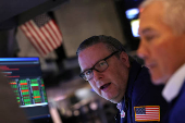 Traders work on the floor of the NYSE in New York