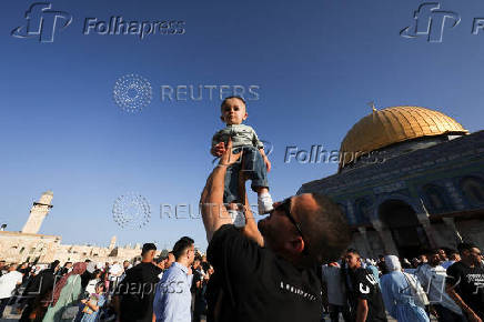 Palestinians pray on the first day of the Muslim holiday of Eid al-Adha, in Jerusalem's Old City