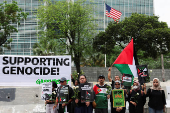 Activists attend a protest against Israel and in support of Palestinians in Gaza, outside the U.S. embassy in Jakarta