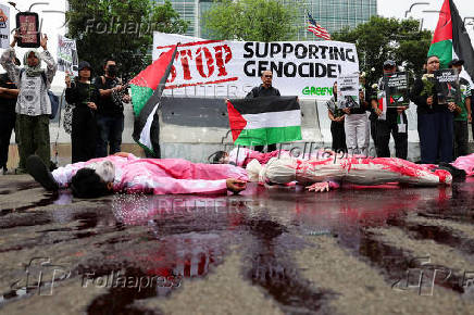 Activists attend a protest against Israel and in support of Palestinians in Gaza, outside the U.S. embassy in Jakarta