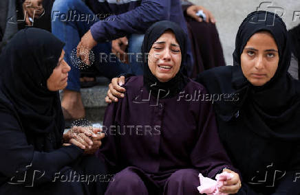 Funeral of Palestinians killed on Sunday by Israeli fire while seeking aid in northern Gaza, according to Gaza's health ministry, at Al-Shifa Hospital