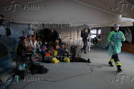 Rescued migrants arrive aboard Sea-Watch 5 ship in Salerno