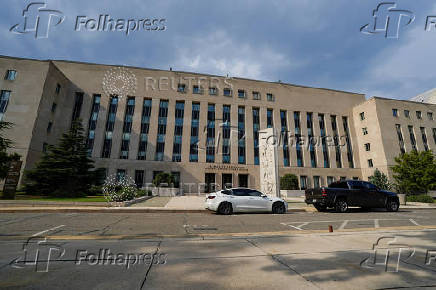 Vehicles drive past the E. Barrett Prettyman U.S. Courthouse in Washington, D.C.