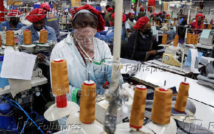 Kenyan workers prepare clothes for export at the United Aryan EPZ factory in Ruaraka district of Nairobi