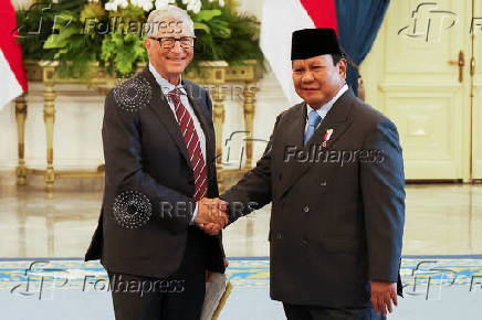 Bill Gates shakes hands with Indonesian President Prabowo Subianto before their meeting at the Merdeka Palace in Jakarta