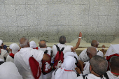 Muslim pilgrims hurl stones during 'stoning of the devil' ritual, in Mina