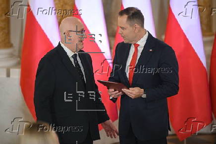 Polish President-elect Karol Nawrocki receives the winning certificate