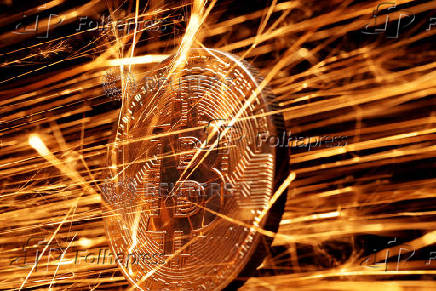 FILE PHOTO: Illustration shows sparks strike representation of cryptocurrency Bitcoin