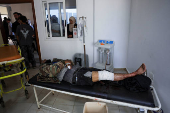 Casualties from recent clashes in Sweida receive treatment at a field medical point in Deraa