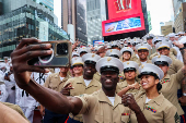U.S. Marines take a selifie in Times Square during Fleet Week 2025 in New York City