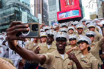 U.S. Marines take a selifie in Times Square during Fleet Week 2025 in New York City
