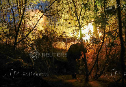 A serviceman of the Ukrainian Armed Forces fires a self-propelled howitzer towards Russian troops at a front line in Donetsk region