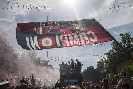 Players of Bologna FC and fans celebrate in Bologna