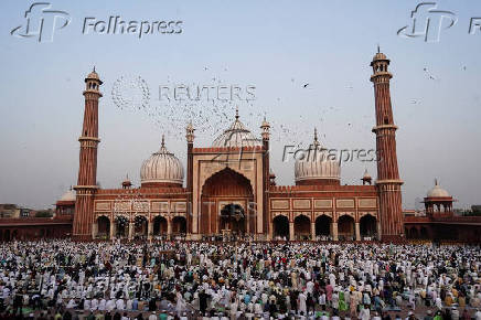 Muslims offer prayers at the Jama Masjid on the occasion of Eid al-Adha, in the old quarters of Delhi