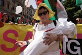 Pro-Palestinian protesters attend a demonstration calling for an end to the bombing in Gaza, in Rome