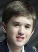 FILE PHOTO: Twelve-year-old U.S. movie star Haley Joel Osment smiles as he speaks to reporters during a news con..