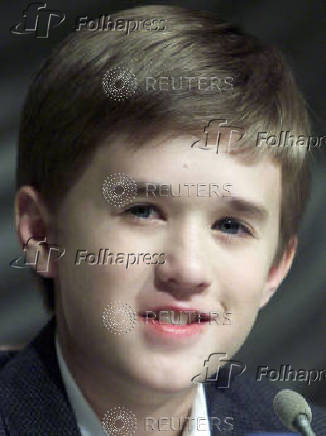 FILE PHOTO: Twelve-year-old U.S. movie star Haley Joel Osment smiles as he speaks to reporters during a news con..