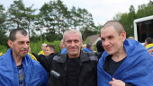 Ukrainian POWs react after a swap at an unknown location in Ukraine