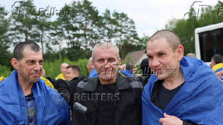Ukrainian POWs react after a swap at an unknown location in Ukraine