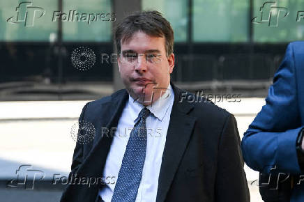 Former MP Craig Williams walks outside Southwark Crown Court in London