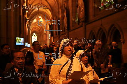 Worshippers participate in Stations of the Cross at St Mary’s Catholic Cathedral in Sydney