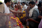 Relatives react next to the body of Yatish Parmar, who was killed in a suspected militant attack near Pahalgam in south Kashmir, after his body was brought to his home in Bhavnagar