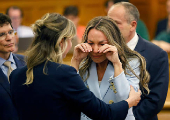 Karen Read reacts as the final verdicts in her murder trial are read at Norfolk Superior Court in Dedham