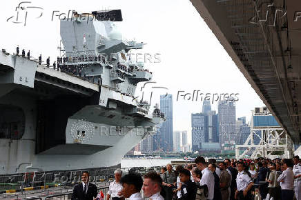 Britain's HMS Prince of Wales aircraft carrier arrives at Marina Bay Cruise Centre in Singapore
