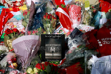 Fans pay their respects to late soccer player Diogo Jota, in Liverpool