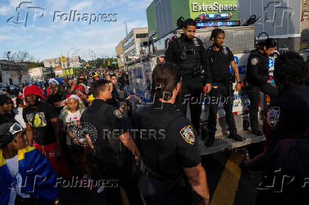 Revelers attend J'ouvert celebration on the day of the annual West Indian Day parade in the Brooklyn borough of New York