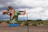Large artwork of James Dean from the film Giant is displayed along Highway 90 at the Wyatt Ranches Little Reata Division outside of Marfa