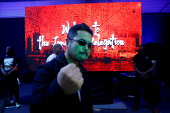 Katsuhiro Harada, Japanese director, producer, and creator of the video game Tekken, visits the Paradise Game room in Abidjan