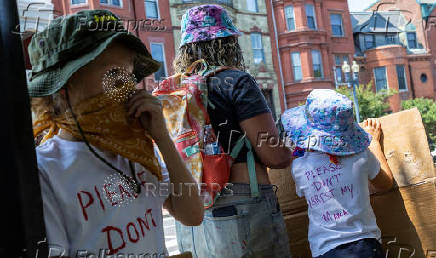 Activists rally during an anti-Trump protest march to the White House in Washington