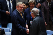 Britain?s Lord Collins of Highbury greets United Nations Secretary General Antonio Guterres ahead of U.N. Security Council meeting on Israel and Palestinian conflict