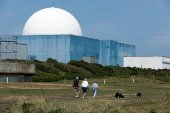 People walk near Sizewell B nuclear power plant in Suffolk England