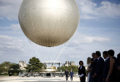 French President Macron visits reinstallation site of Olympic cauldron in Paris