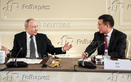 Russian President Vladimir Putin meets with heads of international news agencies in Saint Petersburg