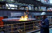 A worker stands near a coke oven at the Magnitogorsk Iron and Steel Works