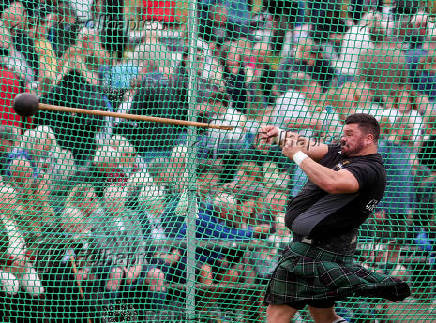 A competitor takes part in the Heavies event during the Braemar Royal Highland Gathering at the Princess Royal and Duke of Fife Memorial Park in Braemar, Scotland