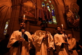 Worshippers participate in Stations of the Cross at St Mary’s Catholic Cathedral in Sydney