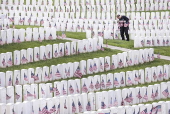 Flags placed on military veteran graves for Memorial Day in Brooklyn