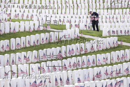 Flags placed on military veteran graves for Memorial Day in Brooklyn