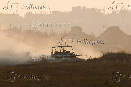 An Israeli tank manoeuvres in Gaza