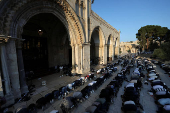 Palestinians pray on the first day of the Muslim holiday of Eid al-Adha, in Jerusalem's Old City