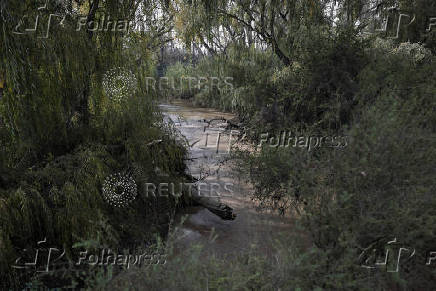 Chilean volunteers combat plastic waste in the Mapocho river, in Santiago