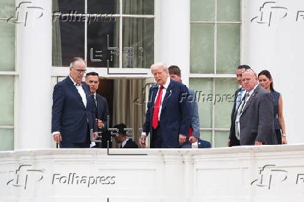 US President Trump walks on roof of the West Wing of the White House