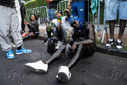 Revelers attend J'ouvert celebration on the day of the annual West Indian Day parade in the Brooklyn borough of New York