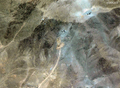 A satellite overview shows excavators at tunnel entrances at the Fordow Fuel Enrichment Facility, amid the Iran-Israel conflict, near Qom