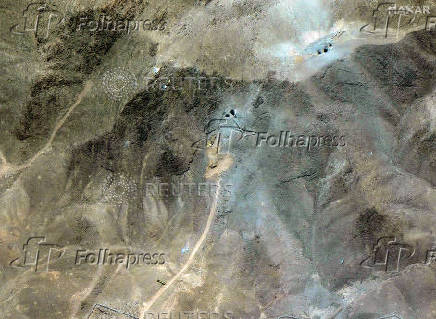 A satellite overview shows excavators at tunnel entrances at the Fordow Fuel Enrichment Facility, amid the Iran-Israel conflict, near Qom
