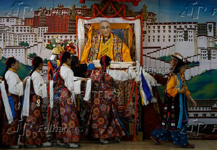 Tibetans mark the 90th birthday celebration of their spiritual leader, the Dalai Lama, at Jawalakhel Handicraft Center in Lalitpur